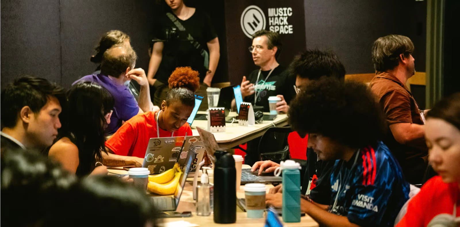 Participants collaborating in teams at a Music Hackspace hackathon